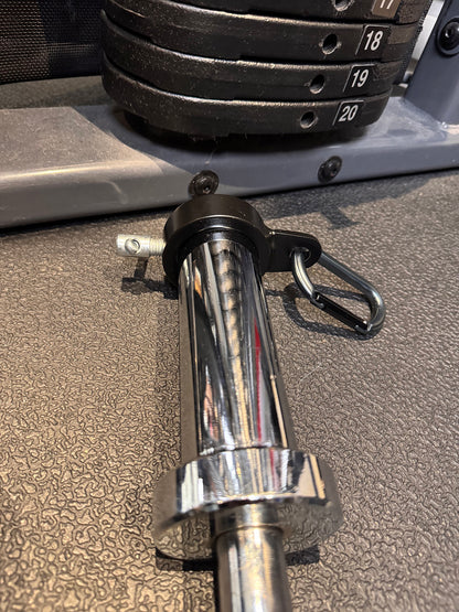 Andreoni cable barbell collar locked onto an Olympic barbell sleeve