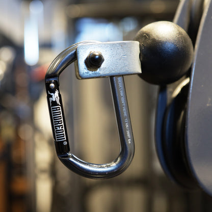 Andreoni gym carabiner clipped to a functional trainer cable