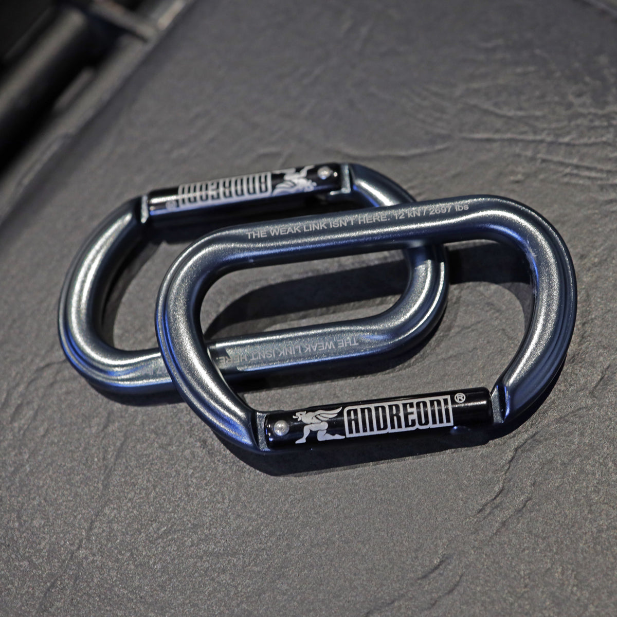 Pair of Andreoni gym carabiners on a gym bench