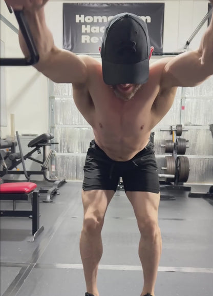 HGHR performing standing straight arms pulldowns with Andreoni bar