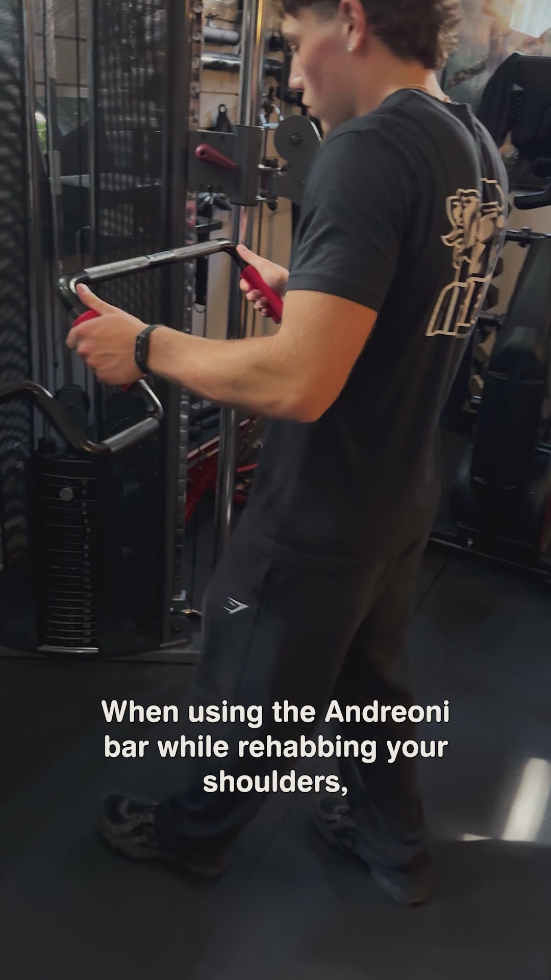 Young man in a home gym performing cable dips pushdowns or assisted dips with the Andreoni bar